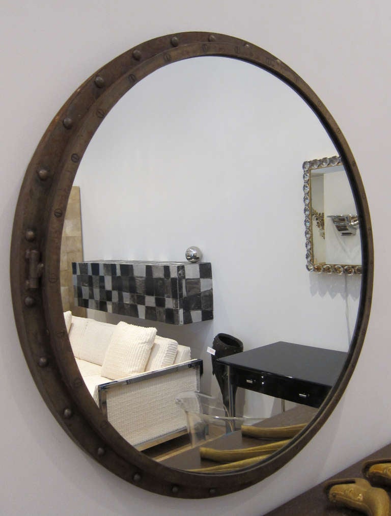 Large iron porthole mirror with bronze patina.

THIS ITEM IS LOCATED IN  MANHATTAN AT  1STDIBS@NYDC SHOWROOM. 
200 LEXINGTON AVE - 10TH FLOOR, NYC.