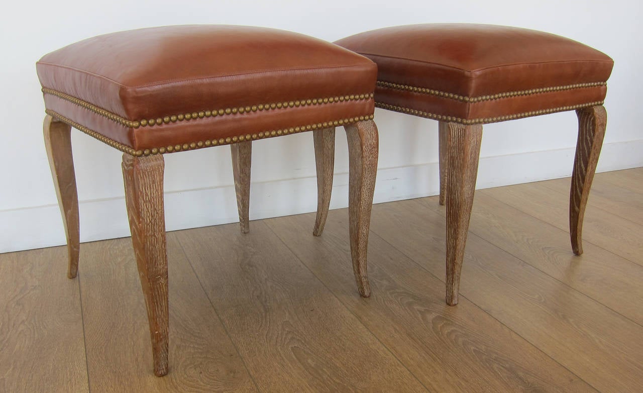 Pair of cerused oak stools upholstered with leather. France, circa 1940s. Two pairs available.

THIS ITEM IS LOCATED IN MANHATTAN AT 1STDIBS@NYDC SHOWROOM. 
200 LEXINGTON AVE - 10TH FLOOR, NYC