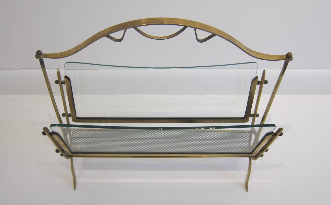 Italian 1950s brass, glass and perforated metal magazine rack.

