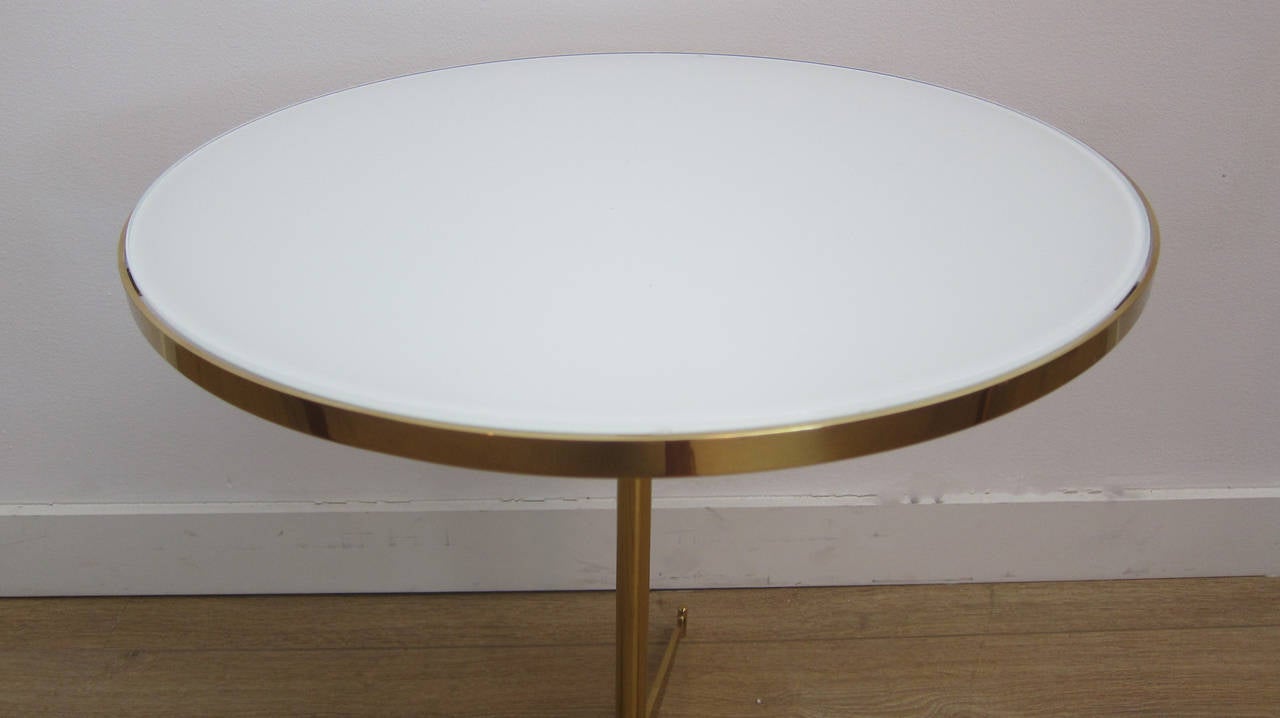 Polished brass and vitrolite top cigarette table by Paul McCobb.