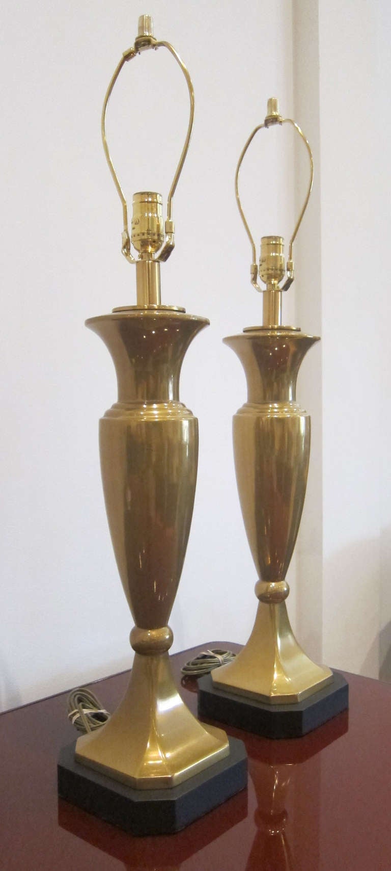 Pair of newly wired and polished brass urns like table lamps. 

THIS ITEM IS LOCATED IN MANHATTAN AT 1STDIBS@NYDC SHOWROOM. 
200 LEXINGTON AVE - 10TH FLOOR, NYC.