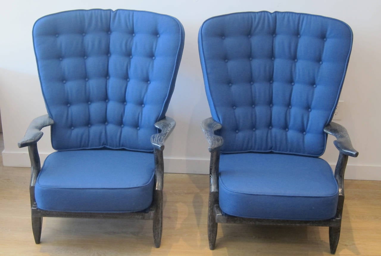 Superb pair of black cerused finger high back lounge chairs by Guillerme and Chambron for Votre Maison, France, circa 1950s.
Newly restored and upholstered to perfection, fabric is a wool felt Baltic blue.
