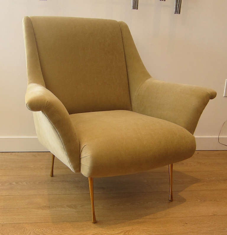 1950's single Italian lounge chair. Exceptional lines, brass plated legs, newly upholstered with a Camel tone velvet.