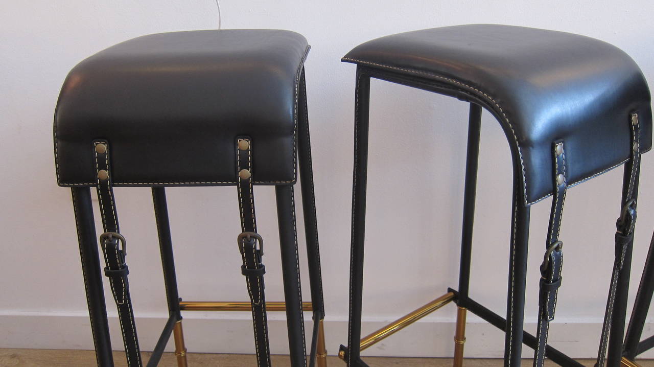 Mid-Century Modern Pair of Black Stitched Leather Bar Stools by Jacques Adnet.
