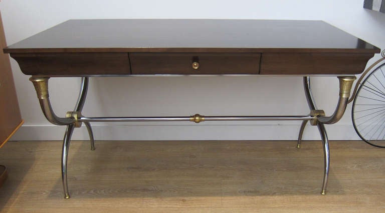 NeoClassical campaign style desk, refinished walnut  top with drawer, polished steel and brass base.

THIS ITEM IS LOCATED IN MANHATTAN AT 1STDIBS@NYDC SHOWROOM. 
200 LEXINGTON AVE - 10TH FLOOR, NYC