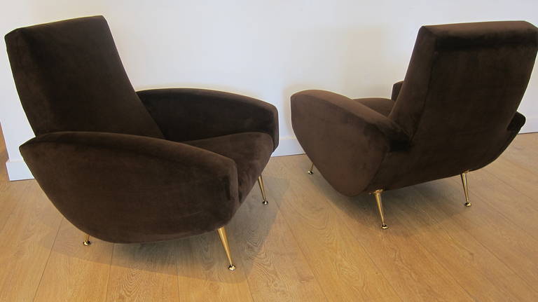 1950's Italian lounge chairs, brass legs restored to perfection, newly upholstered with chocolate brown velvet. These chairs have a great proportion.

THIS ITEM IS LOCATED IN MANHATTAN AT 1STDIBS@NYDC SHOWROOM. 
200 LEXINGTON AVE - 10TH FLOOR, NYC