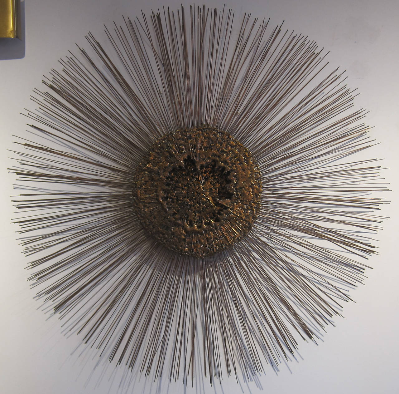 Large sunburst wall sculpture of two layers of copper, brass and dripped bronze  USA circa 1970's.
this item is located in Manhattan at 1stdibs@nydc showroom. 
200 Lexington Ave 10th floor, NYC