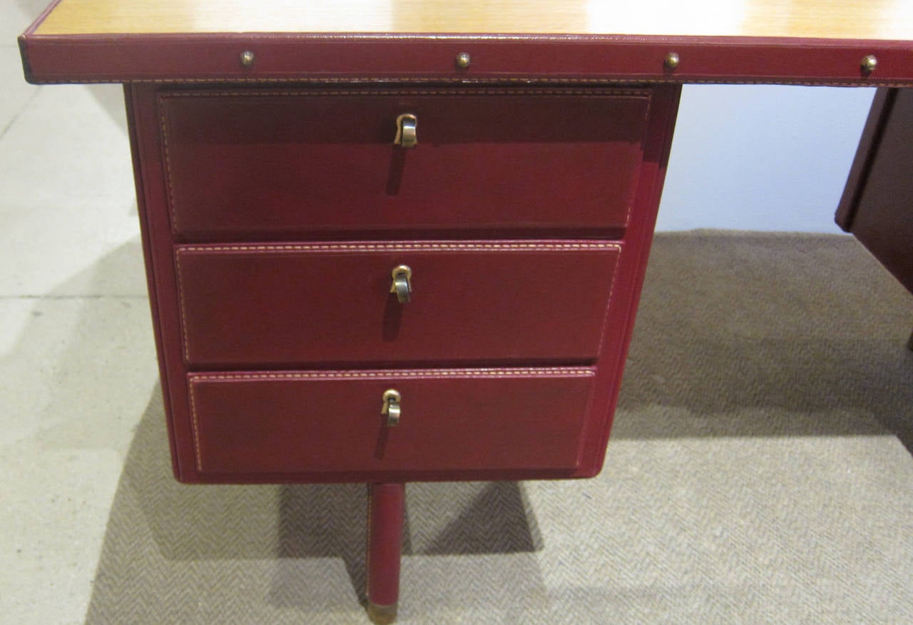 Brass Red Stitched Leather Desk by Jacques Adnet.