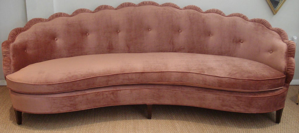 Glamourous 1940's curved sofa, attributed to Dorothy Draper. Newly upholstered in luxurious 