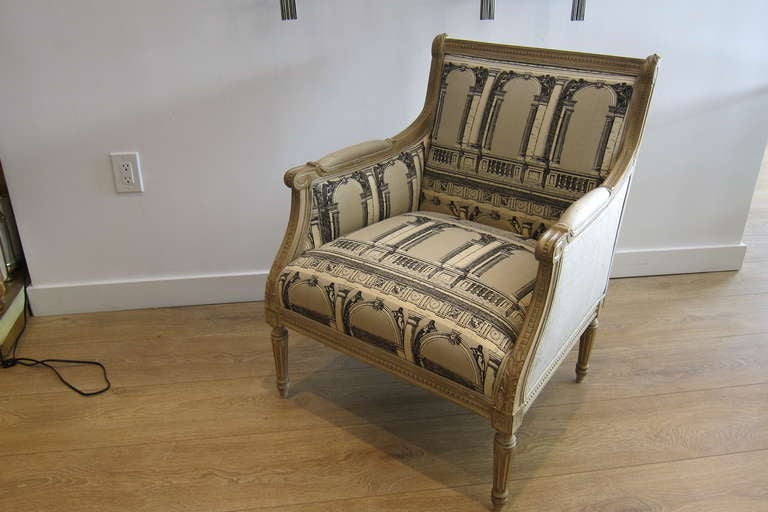 Pair of Louis XVI style French bergeres, circa 1960's. Newly upholstered in two tone, with a vintage Fornasetti's fabric (design based on the Procuratie Nuove, Venice), and raw silk velvet.
