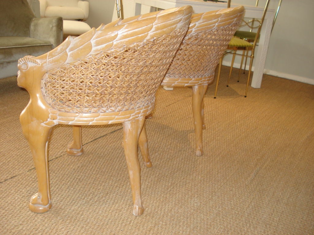 Pair of double caned Zoomorphic Armchairs.