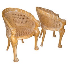 Pair of double caned Zoomorphic Armchairs.