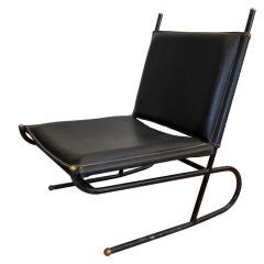 Lounge Chair by Jacques Adnet.