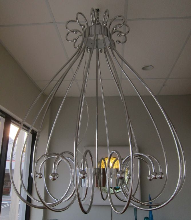 Oversized bird cage chandelier after Dorothy Draper. Polished aluminum restored to perfection.