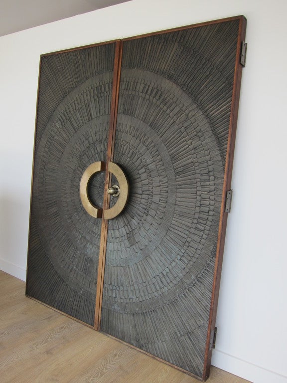 Pair of heroic sunburst doors, by David Gillespe and Billy Joe McCarroll for Forms and Surfaces, made of composite,bronze hardware and walnut. Doors are finished the same on opposite sides. Original finish, light verdigris, complete with original