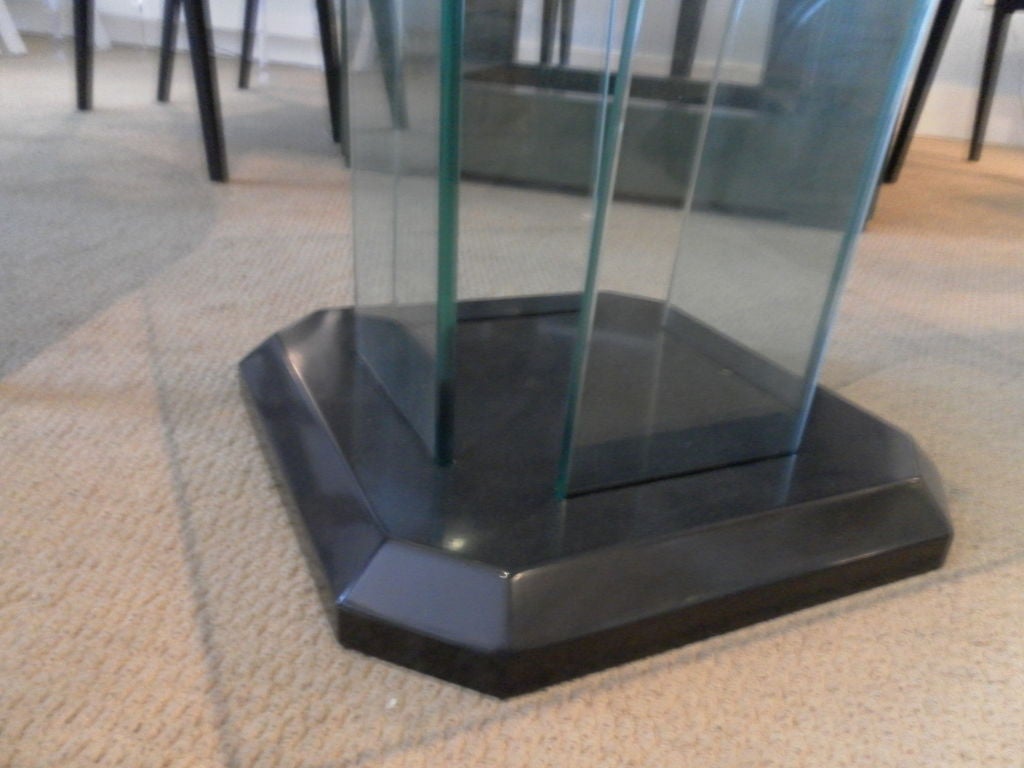 Wood painted base in black with 4 - 1/2" thick curved glass panels and 3/4" thick glass top . Base 15" sq.  Glass top 24" sq.  Similar coffee table also available.