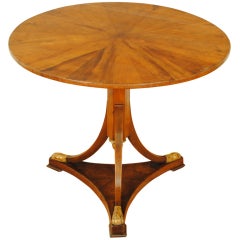 An Early 19th century Italian Empire Period Walnut and Giltwood Center Table