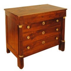 A French Empire Period Walnut and Bronze Mounted 4-Drawer Commode