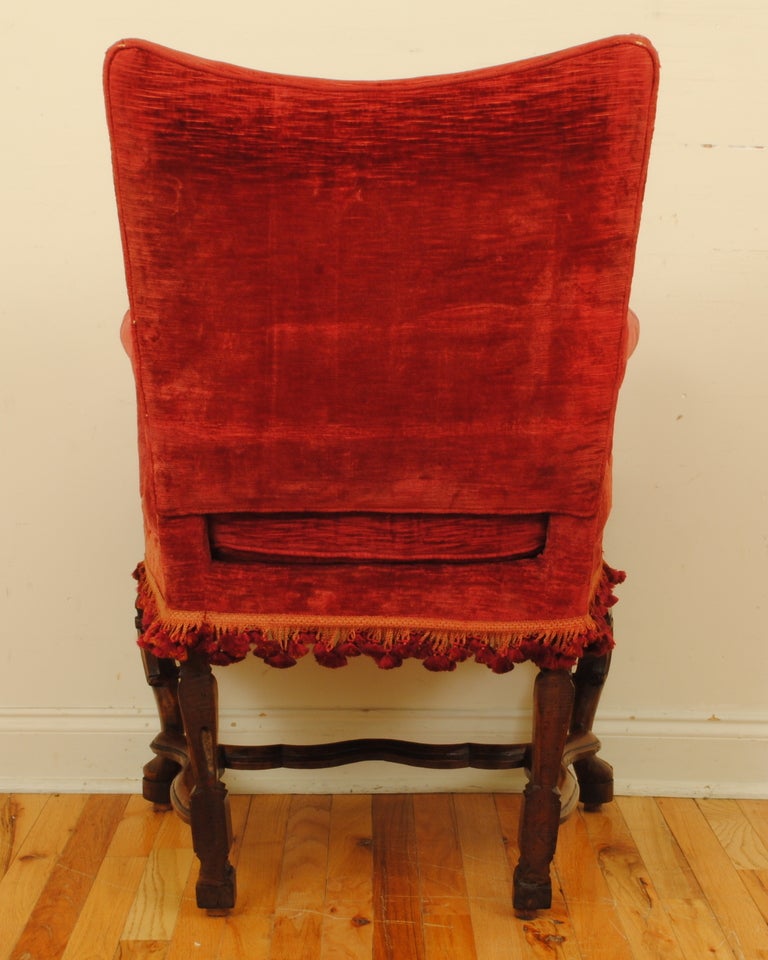 18th Century and Earlier An Italian Louis XIV Period Walnut and Velvet Upholstered Poltrona