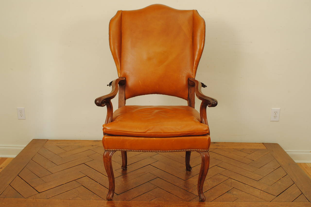 Italian Rococo Walnut and Leather Upholstered Reclining Wing Chair In Excellent Condition In Atlanta, GA