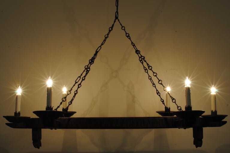 A Rustic French Pinewood and Iron 6 Light Horizontal Chandelier