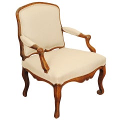 A Unique French Louis XV Carved Walnut Fauteuil