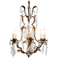 A French Louis XV Style Wrought Iron, Gilt Metal, and Glass 6-Light Chandelier