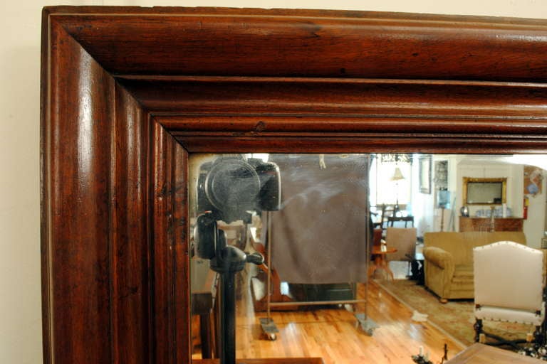 A French Mid 19th Century Late Neoclassic Large Walnut Mirror In Excellent Condition In Atlanta, GA