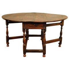 A Large George II Period Turned Oak Two-Drawer Gateleg Table