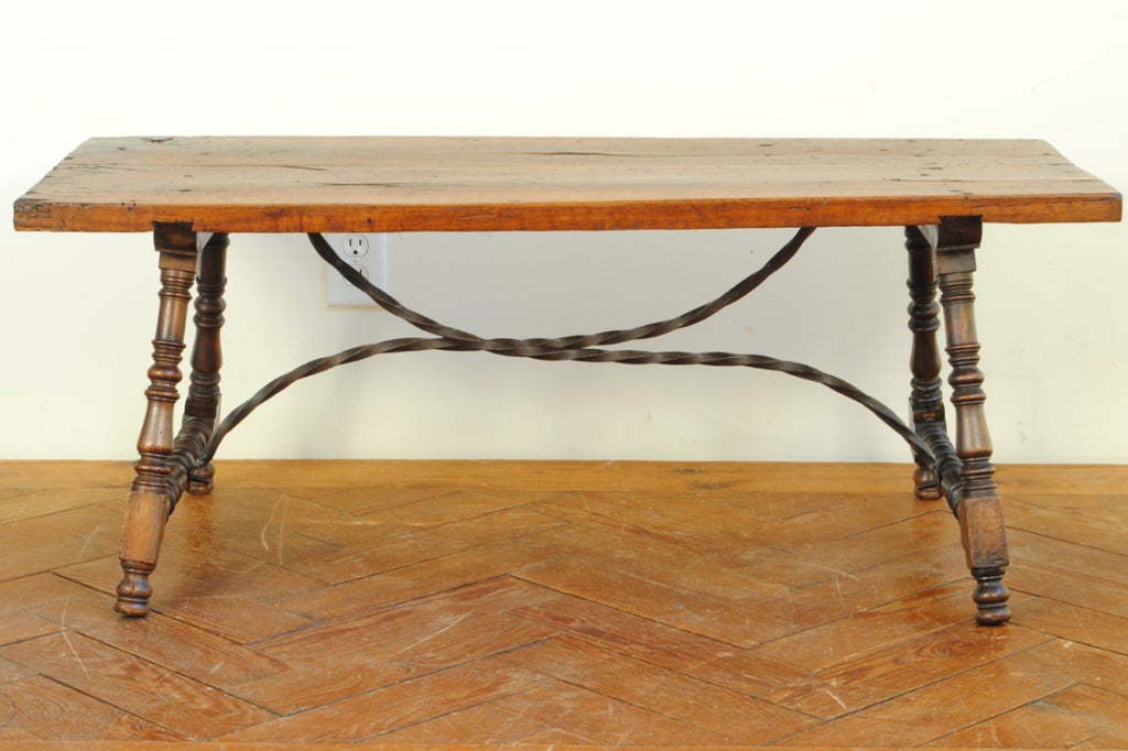 A Spanish Late Baroque Walnut Coffee Table with Iron Stretcher