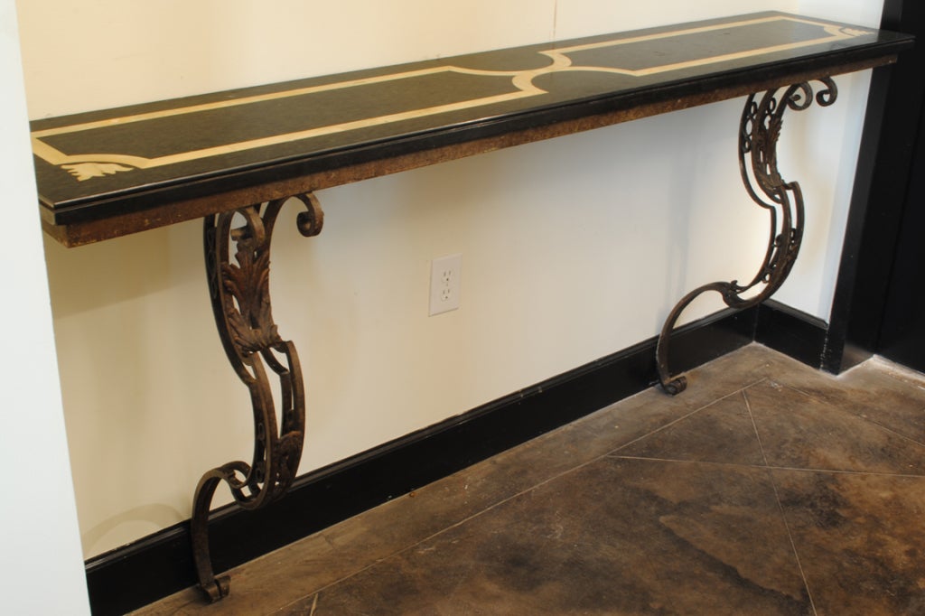 An Italian Rococo Style Gilt Iron and Marble Top Console