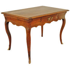 A French Walnut Louis XV Table with Brass Mounts