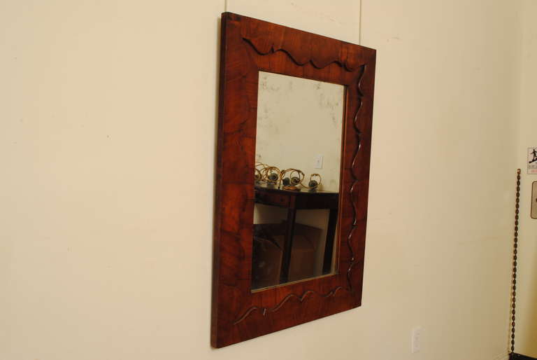Louis Philippe A French Mid 19th Century Shaped Mahogany Veneer Mirror
