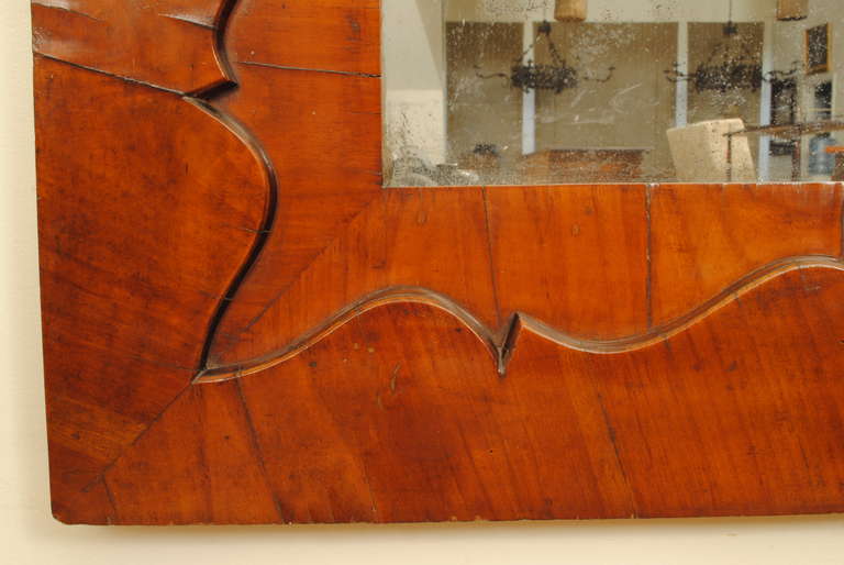 A French Mid 19th Century Shaped Mahogany Veneer Mirror In Good Condition In Atlanta, GA
