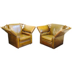A Pair of Italian Leather Upholstered Adjustable Chairs