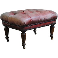 A French Louis Philippe Tufted Leather and Turned Oak Footstool