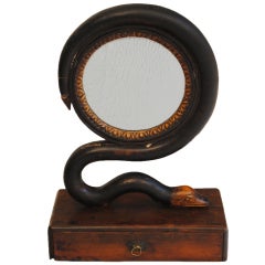 A Regency Walnut, Ebonized, and Giltwood Serpent Form Mirror