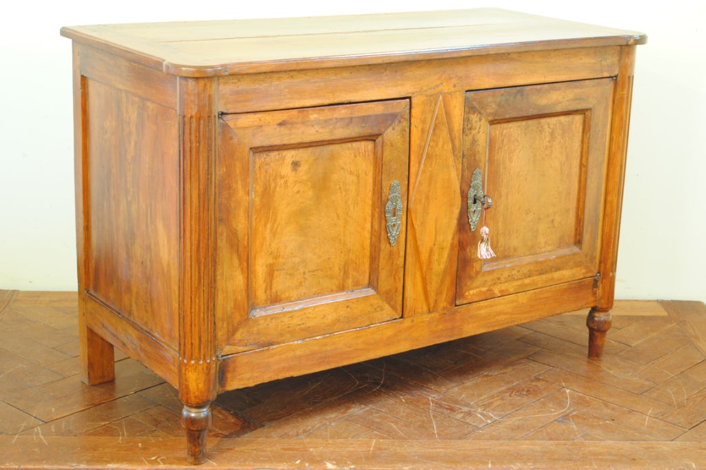 A French Walnut Directoire Period Carved and Paneled Buffet