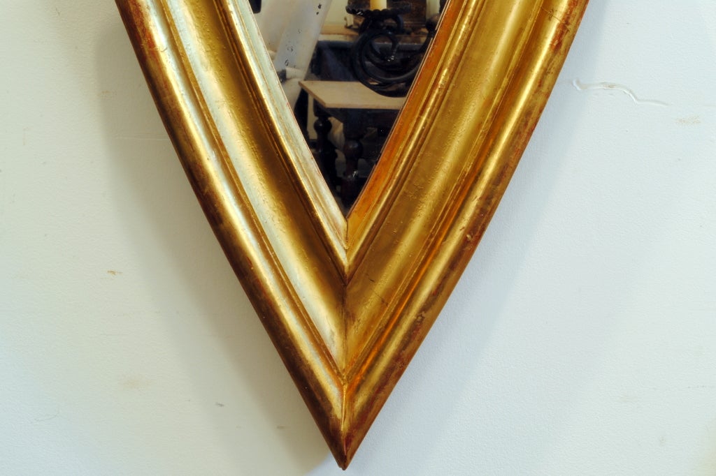 A French Neoclassical Mid 19th Century Shield Form Gilded Mirror In Excellent Condition In Atlanta, GA