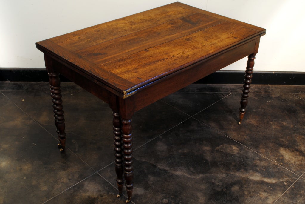 A French Turned Oak Mid 19th Century Fold-Over Dining Table In Excellent Condition In Atlanta, GA