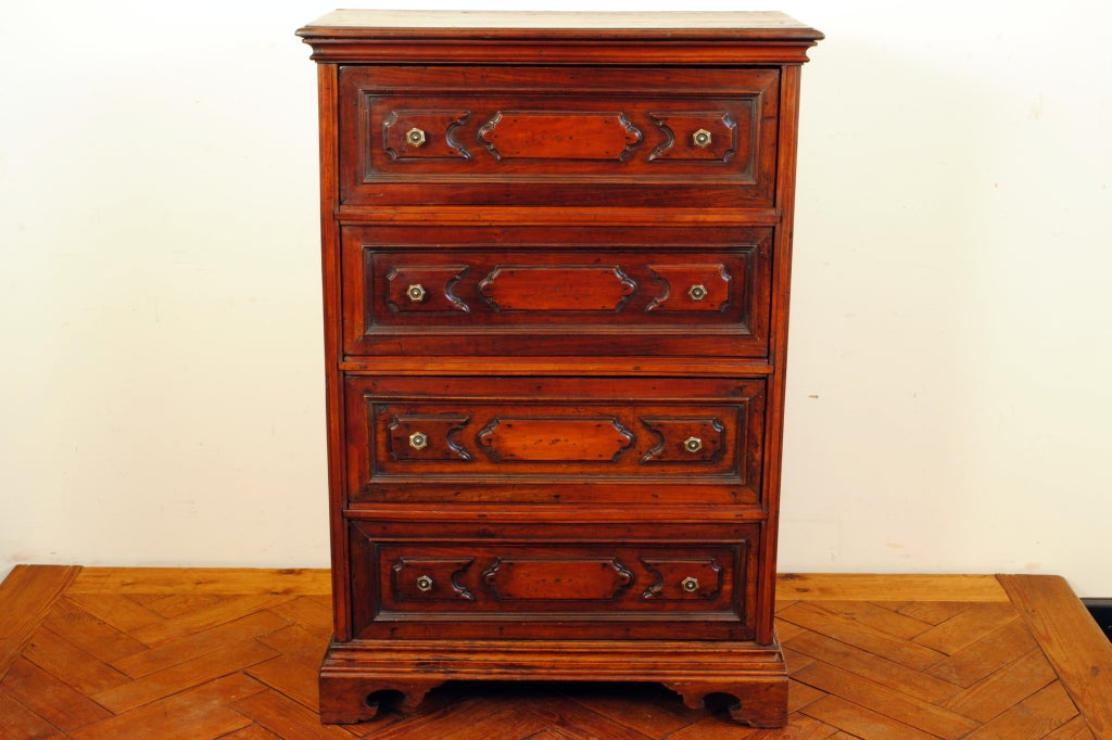 An Italian Baroque Style Walnut Tall 4-Drawer Commode