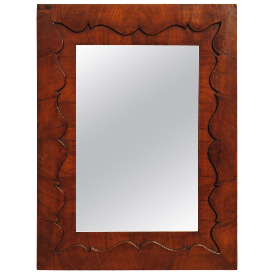 A French Mid 19th Century Shaped Mahogany Veneer Mirror