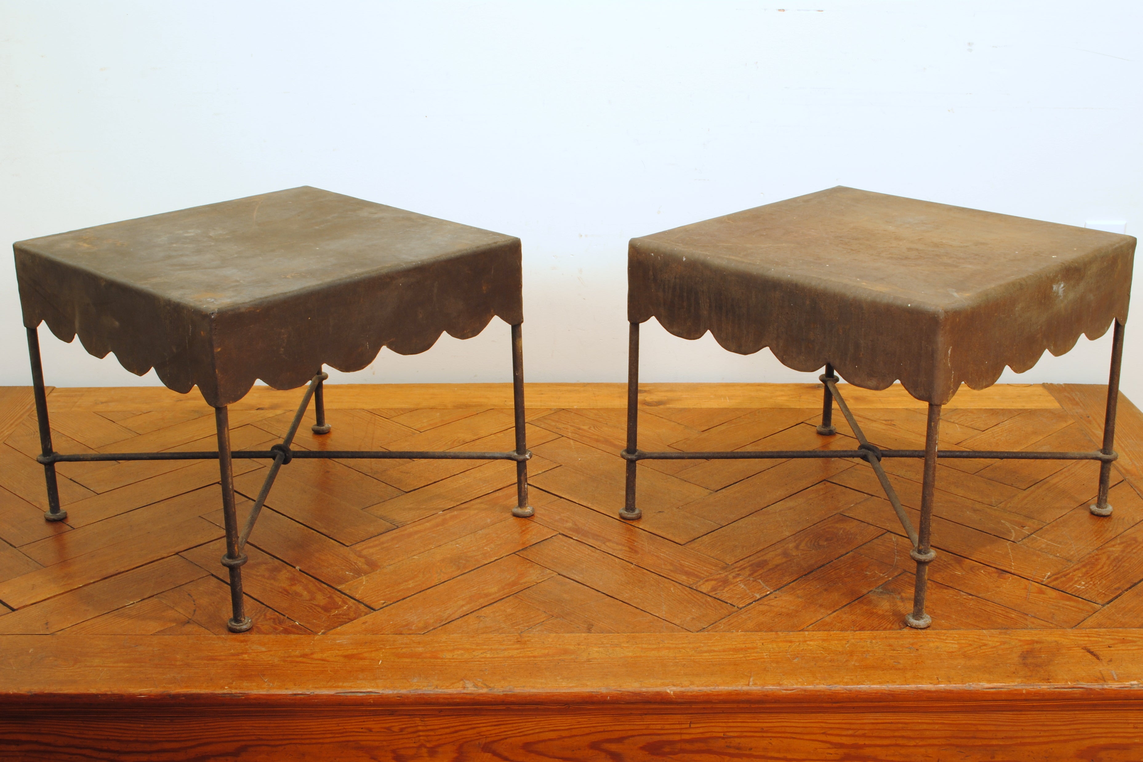 A Pair of French Wrought Iron and Scalloped Metal End Tables