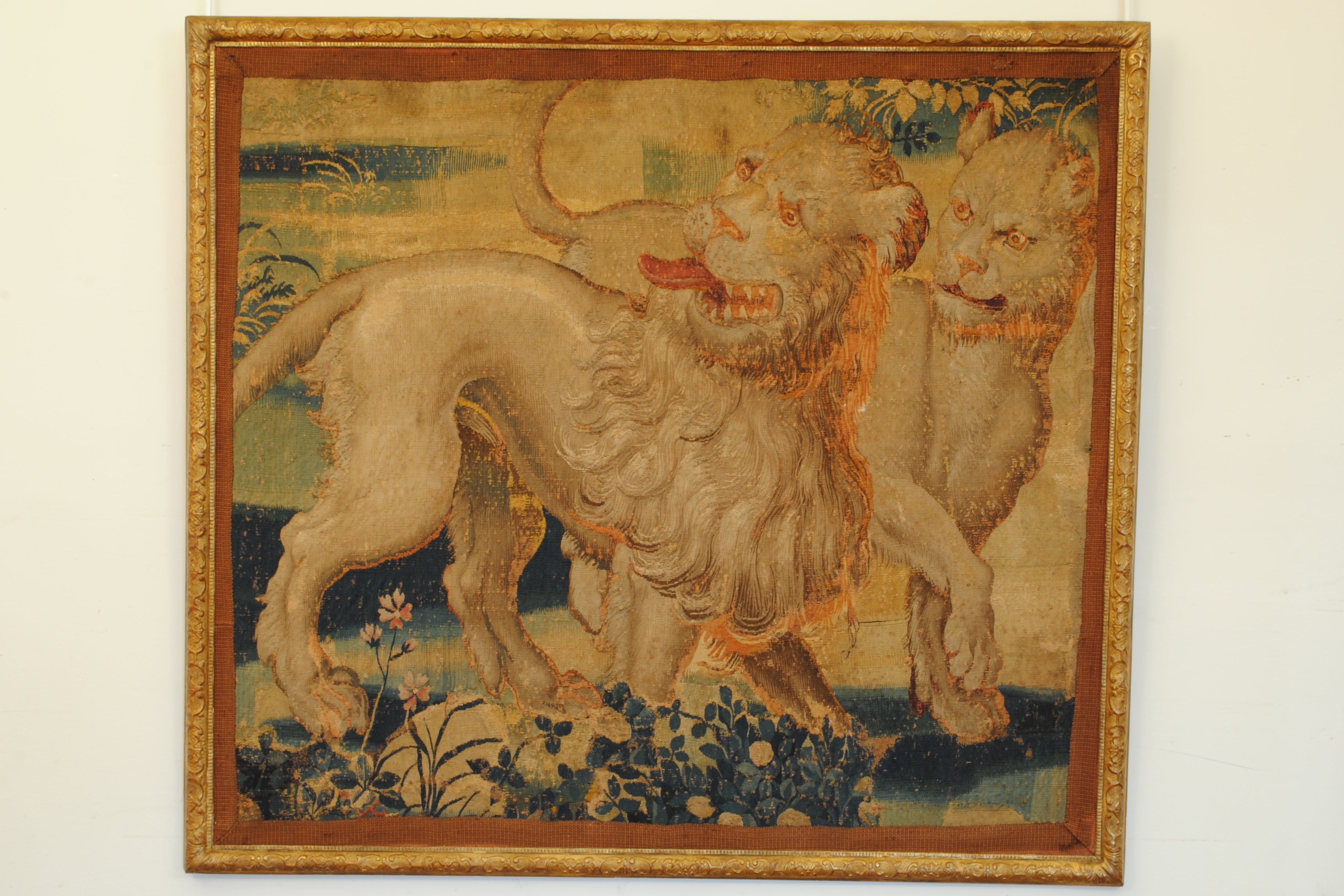A 17th Century Flemish Tapestry Fragment in a Regence Giltwood Frame