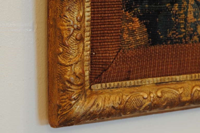 A 17th Century Flemish Tapestry Fragment in a Regence Giltwood Frame 1