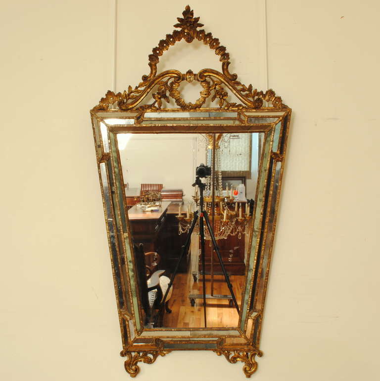 carved giltwood upper medallion, trim, and feet, original mirror plate framed by a perimeter of smaller mirrored sections

Please go to www.robuck.co to see our complete inventory.