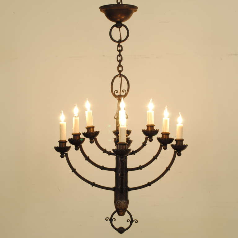 the central column terminating in a lions head holding a stylized ring in its mouth, having 12 arms and three tiers, *with existing chain and canopy, chandelier measures 37.5 inches in height

Please go to www.robuck.co to see our complete