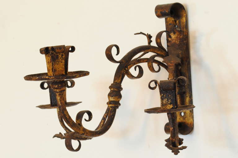 Baroque Pair of Italian Wrought and Gilt Iron Three-Light Wall Sconces