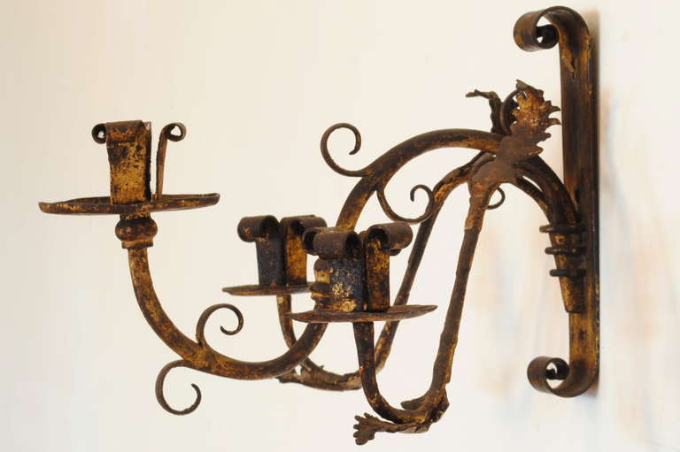 Pair of Italian Wrought and Gilt Iron Three-Light Wall Sconces In Excellent Condition In Atlanta, GA