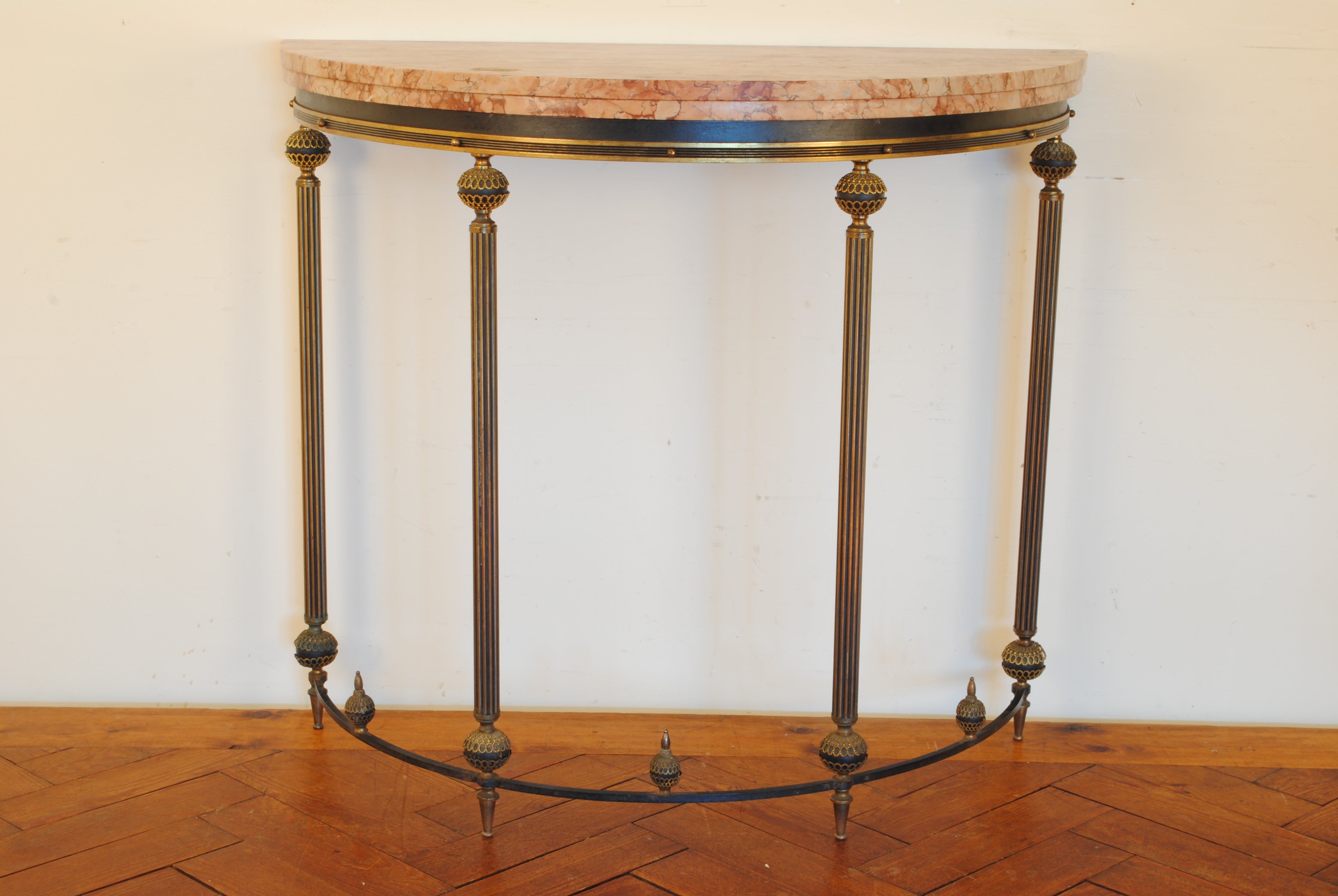 A Continental Louis XVI-Style Gilt and Patinated Bronze Demilune Console